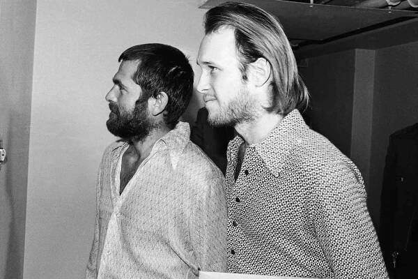 Bruce Davis and Steve Grogan leave court on December 22, 1970, Los Angeles, Calif.
