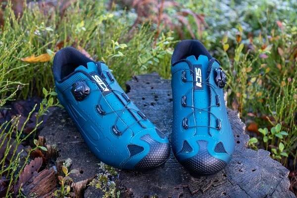 Sidi Dust MTB shoes on a wooden stump