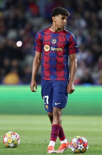 Barcelona's Spanish forward #27 Lamine Yamal looks on before the start of the UEFA Champions League quarter-final second leg football match between FC Barcelona and Paris SG at the Estadi Olimpic Lluis Companys in Barcelona on April 16, 2024