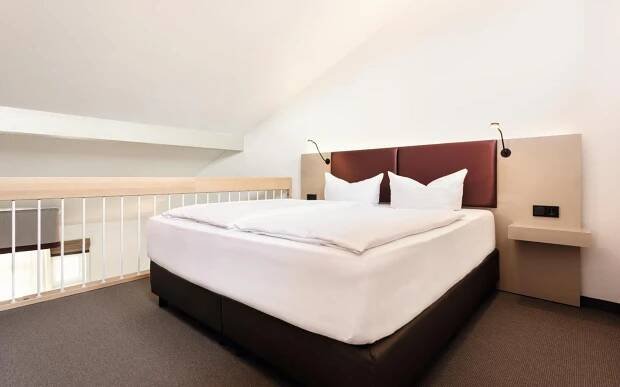 Postel nebo postele na pokoji v ubytování Donna Hotel Klosterhof
