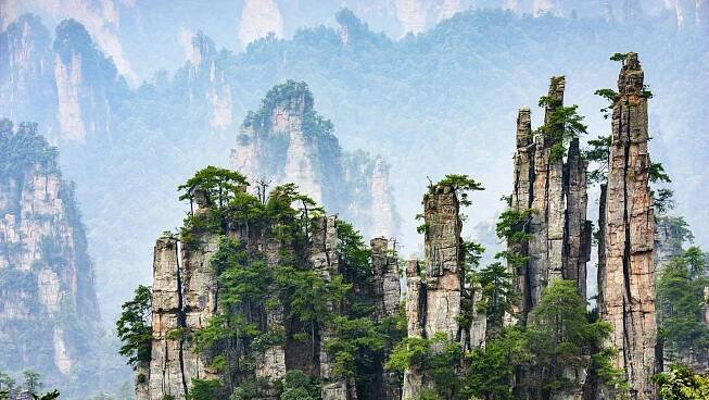 Viral videos prompt mass cleanup of caves near China’s famed ‘Avatar’ mountains