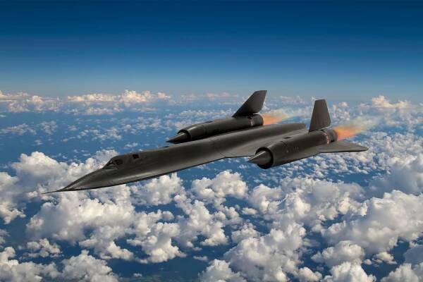 A SR-71 Blackbird flying above the clouds.