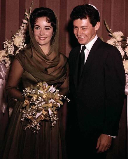 Eddie Fisher and Elizabeth Taylor are shown after their wedding in 1959.