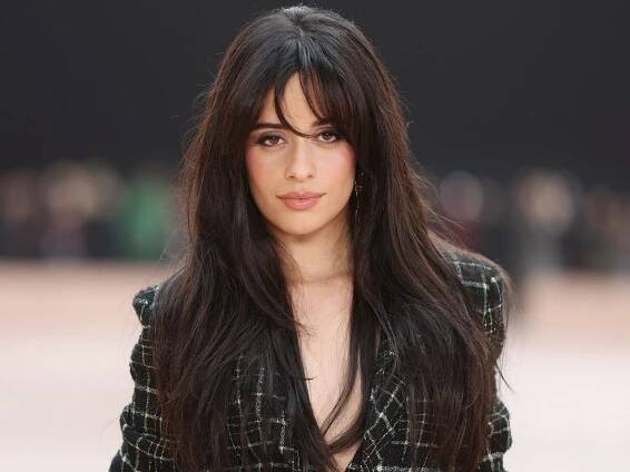 Camila Cabello steps out in figure-hugging minidress and knee-high boots in LA