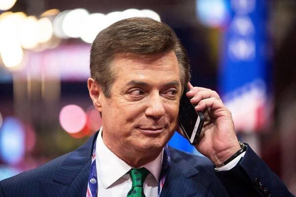 Paul Manafort listening to a call on an iPhone