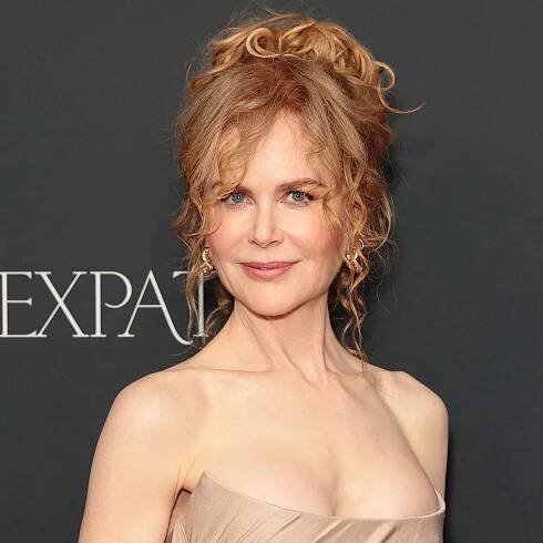 Nicole Kidman with a curly strawberry blonde updo on the red carpet