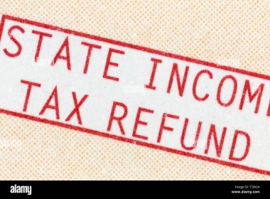 Macro detail of state income tax refund check paper statement text. Stock Photo