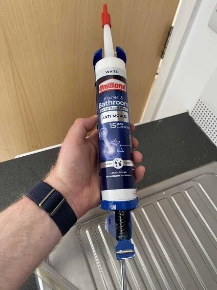 Attach the Unibond Anti-Mould Silicone Sealant tube to the caulking gun