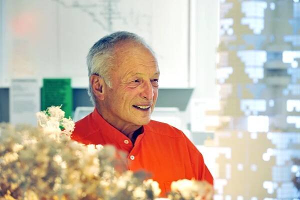 Richard Rogers stands alongside one of his models | image by PA Images | Alamy Stock Photo