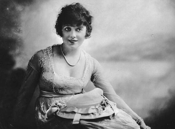 Mabel Normand in lace dress and pearls