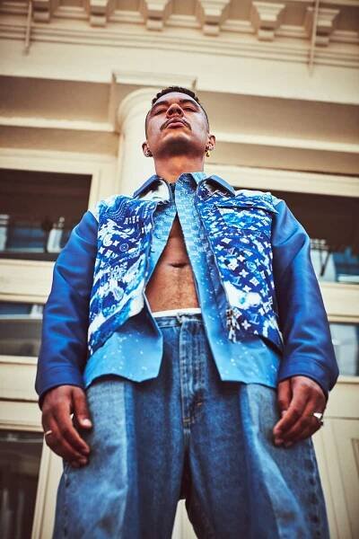 Ismael wears jacket and shirt by LOUIS VUITTON; Ismael’s own customized vintage LEVI jeans; underwear by JOCKEY; earring by JENNIFER FISHER; necklace, earrings and rings by M JEWELERS.