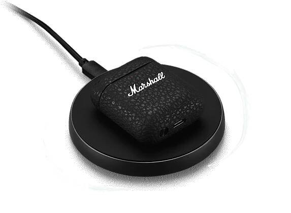 Marshall Minor III Black Headphones charging on a Wireless charger