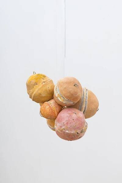 Untitled (Citrus Balls 2) Solid cast acrylic rod, various citrus fruit rinds, epoxy putty, oil pastel, stainless steel wire, and enamel; dimensions variable; 2018