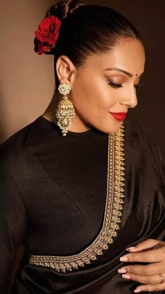 Bipasha Basu captivates in a timeless black satin saree