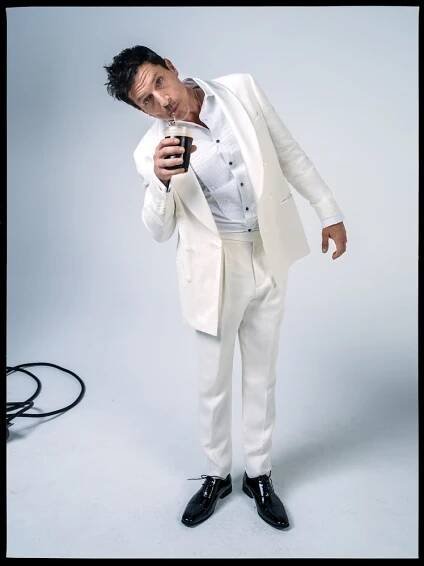 Simon Rex wears a Brunello Cucinelli tuxedo and shirt; Florsheim shoes.