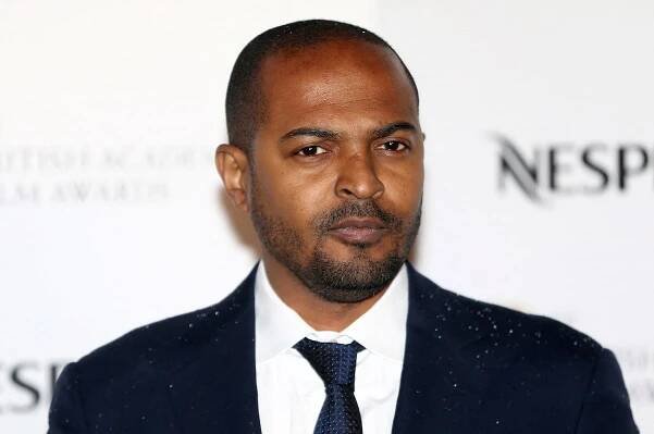 Actor Noel Clarke poses for photographers at the British Academy Film Awards Nominees Party at Kensington Palace in London
