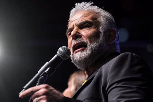 Israeli opposition leader and parliament member Yair Lapid speaks during an anti-government protest in Tel Aviv on December 21, 2024.