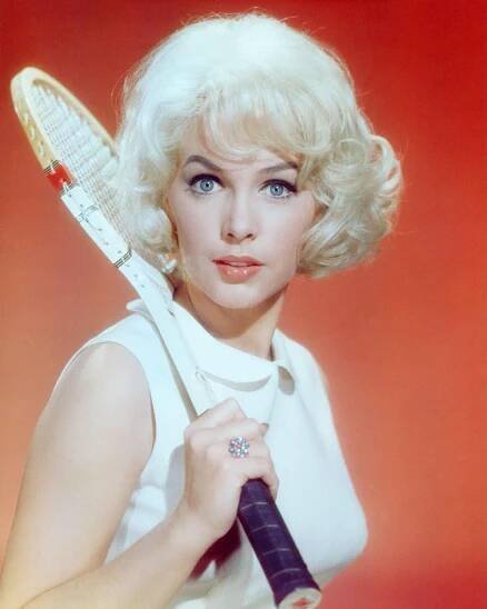 Stella Stevens, Holds A Wooden Tennis Racquet Over Her Shoulder, 1960.