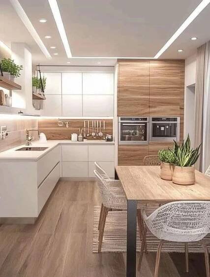 the kitchen is clean and ready to be used for dinner or lunch time, as well as dining room furniture