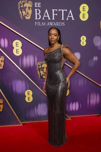 Naomi Ackie posing for photographers on the red carpet at the 78th British Academy Film Awards in London.