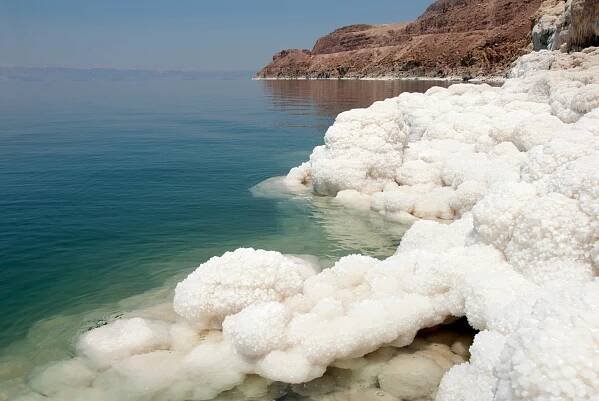 Salted Water in the Dead Sea with salt crystals (Jordan)