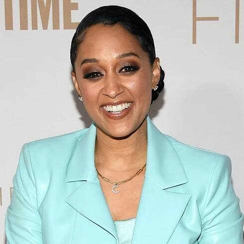 Name a Better Combo Than Tia Mowry's Curly Cornrows and Purple Eye Makeup — See Video