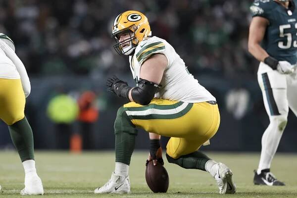 Josh Myers #71 of the Green Bay Packers gets ready to snap the ball during a Wild Card Playoff Game against the Philadelphia Eagles at Lincoln Financial Field on January 12, 2025 in Philadelphia, Pennsylvania. The Eagles defeated the Packers 22-10. 