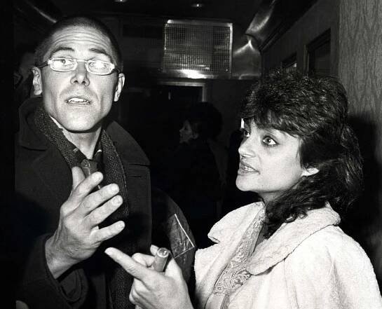A man and a woman talking in 1982