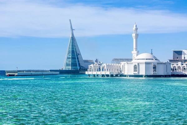 The serene view of Alrahmah Floating Mosque by the turquoise waters of Jeddah, inviting exploration and discovery | MSC Cruises