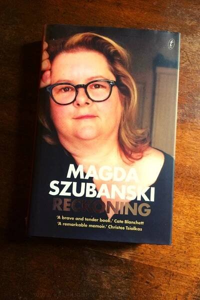 Reckoning - Magda Szubanski - Book Laid on Wooden Table - Keeping Up With The Penguins