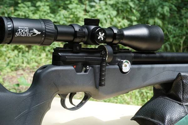 The Origin uses a side lever action.