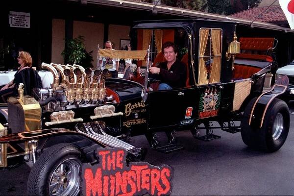 384600 17: Former child star Butch Patrick poses with the Munster Mobile at the Hollywood Collectors and Celebrity Show held at the Beverly Garland Holiday Inn January 20, 2001 in North Hollywood, CA. 
