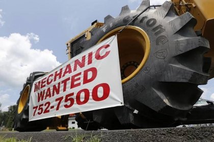 A help wanted sign is posted at a tractor dealership in Ashland, Va.