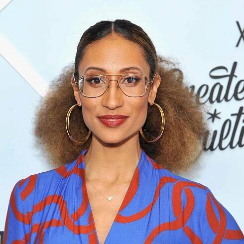 Elaine Welteroth with an afro hairstyle pulled into a low ponytail