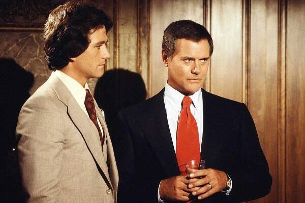  DALLAS cast members Patrick Duffy (as Bobby Ewing) and Larry Hagman (as John Ross 'J.R.' Ewing, Jr.). August 1978. 