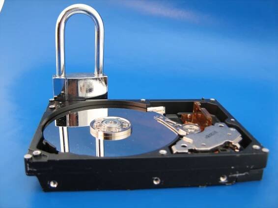 Hard disk with a padlock behind it