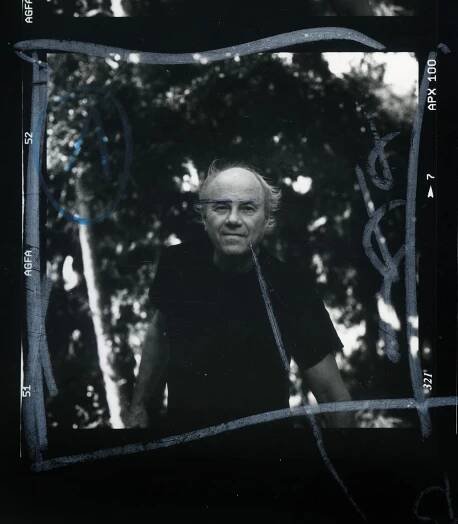 Contact sheet of James Rosenquist in a black t-shirt.