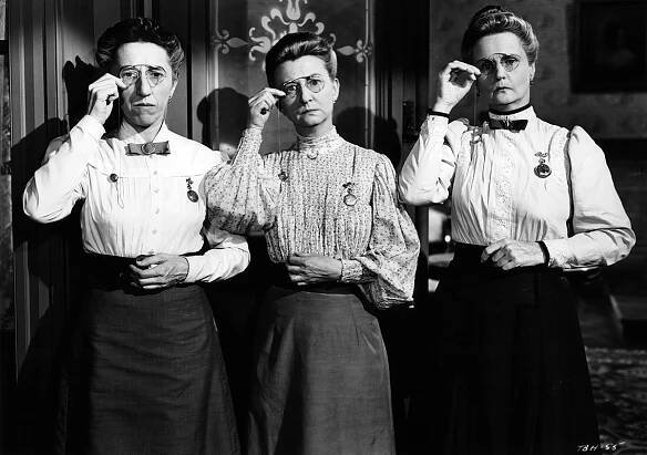 Margaret Hamilton, Irene Ryan, and Moyna Magill adjust their glasses in a scene from the film Texas, Brooklyn and Heaven, 1948: The Beverly Hillbillies cast young