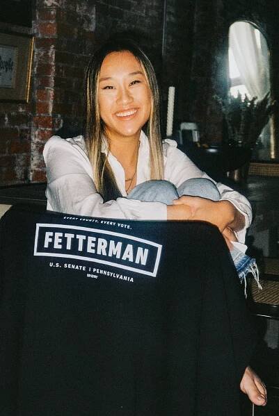 Ms. Henry poses with a black hoodie with “Fetterman” emblazoned on the back.