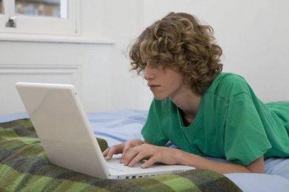 A Student Using a Laptop