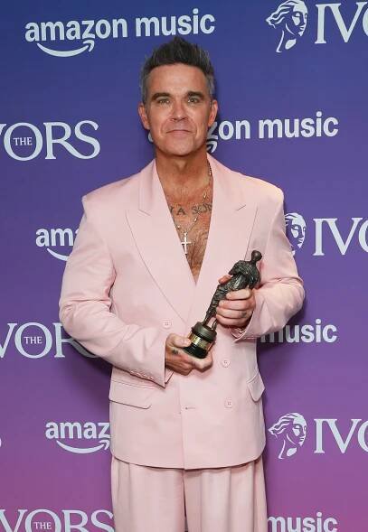 Robbie Williams accepting the Icon Award.