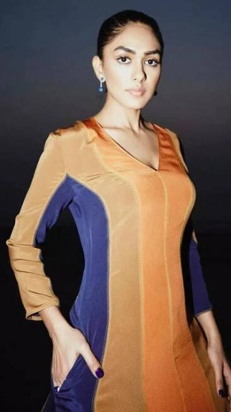Mrunal Thakur Shines in Vibrant Orange Outfits