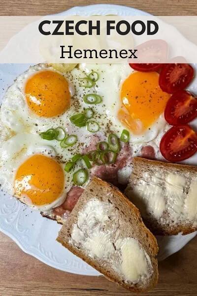 a plate with eggs, bread and tomatoes on it that says czech food hennex