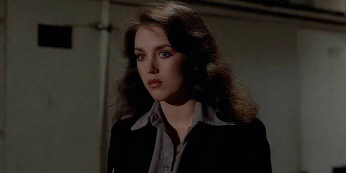 Isabelle Adjani looking attentively at someone or something off-camera in The Driver.